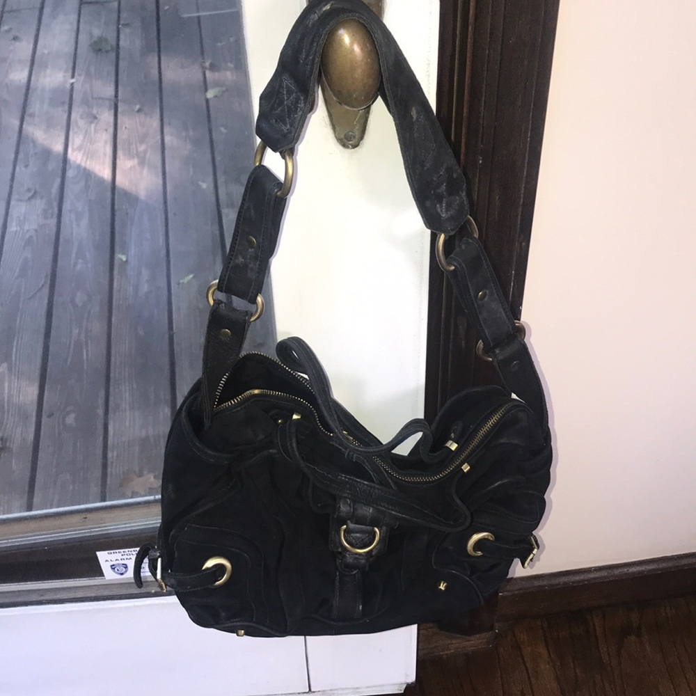 Black leather satchel tote bag with gold hardware
